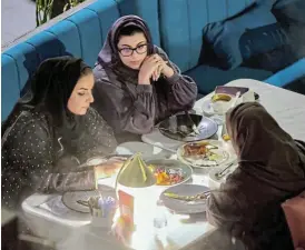  ?? /Reuters ?? Industrial chic: Saudi women sit at David Burke’s restaurant in the open-air mall The Zone in Riyadh. It is the second of six that Burke plans to open in the kingdom.