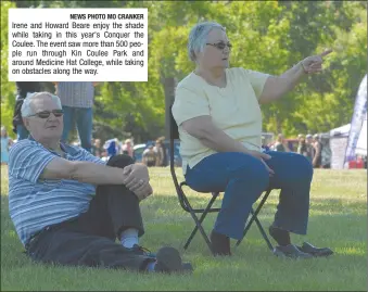  ?? NEWS PHOTO MO CRANKER ?? Irene and Howard Beare enjoy the shade while taking in this year's Conquer the Coulee. The event saw more than 500 people run through Kin Coulee Park and around Medicine Hat College, while taking on obstacles along the way.