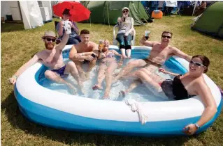 ??  ?? Paddle power: Campsite stewards keep cool in their very own pool