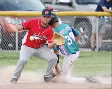  ?? Tim Conover ?? Hagan Campbell #22 of Broken Bow, pictured above, gets the throw a little late to be able to tag out the Overton base runner at third Thursday evening at Paul Brown Field.