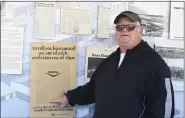  ?? JESI YOST - FOR MEDIANEWS GROUP ?? Dana Inc. retiree Larry Wallace, points to his name on an ad that hangs on the “History Wall” at the company’s Pottstown plant. Dana ran a full-page ad in The Mercury on Saturday, Jan. 6, 1979, listing all of their area employees in alphabetic­al order. Wallace worked at Dana from 1972 to 2002.