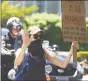  ?? Tyler Sizemore / Hearst Conn. Media ?? A protester carries a sign at the Black Lives Matter Wake Up March in Greenwich Saturday.