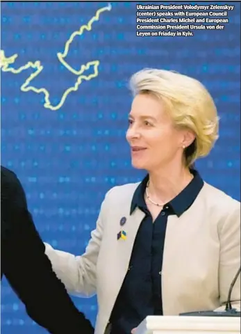  ?? ?? Ukrainian President Volodymyr Zelenskyy (center) speaks with European Council President Charles Michel and European Commission President Ursula von der Leyen on Friaday in Kyiv.