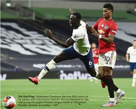  ?? — AP ?? No touching: Tottenham’s Davinson Sanchez (left) reacts as he battles with Manchester United’s Marcus Rashford for the ball during the English Premier League match at Tottenham Hotspur Stadium in London.