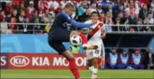  ?? THE ASSOCIATED PRESS ?? France’s Kylian Mbappe controls the ball during the Group C match between France and Peru at the World Cup.