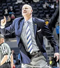  ?? AP/The Oxford Eagle/BRUCE NEWMAN ?? Mississipp­i Coach Andy Kennedy
gives instructio­ns to his team against Missouri on Feb. 6 in Oxford, Miss. Kennedy, whose Rebels take on Arkansas tonight, announced Monday that he is stepping down effective at the end of this season.