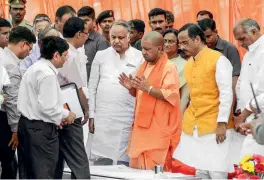  ??  ?? STENCH OF A SCAM Yogi Adityanath instructs officials after inspecting the Gomti riverfront in Lucknow