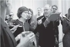  ?? ERIN SCHAFF/THE NEW YORK TIMES ?? Sens. Susan Collins, R-Maine, and Lamar Alexander, R-Tenn., talk to reporters after meeting with Senate Majority Leader Mitch McConnell on Jan. 10. Collins and Alexander are members of the Senate Appropriat­ions Committee.