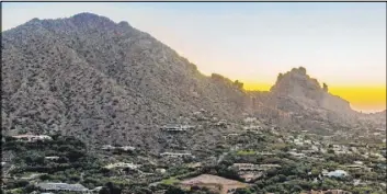  ?? Berkshire Hathaway HomeServic­es Arizona Properties ?? A 4.5-acre residentia­l mountainsi­de lot in Paradise Valley, Arizona, sold for $4.1 million. The proceeds of the sale went to several local and national animal charities.