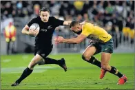  ?? Picture: AFP ?? GOT HIM: New Zealand’s Ben Smith is tackled by Australia’s Quade Cooper during their Test played at Westpac Stadium in Wellington on Saturday