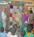  ?? Submitted photo ?? Members of Keystone Community Fellowship present a quilt made by children at St. Mary’s Villa in Ambler to the children at Esther’s House orphanage community during a recent missionary trip to Malawi.