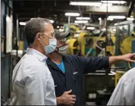  ?? (Special to the Democrat-Gazette) ?? Chris Metz, Vista Outdoor chief executive officer, gets a tour of the Vista Outdoor facility in Lonoke, the former Remington ammunition plant. Metz said the company is working to bring the Lonoke operation back to full production.