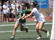  ?? ?? Mira Costa's Elise Murphy tries to get away from Marlboroug­h's Samantha Norman in Downey on Saturday.