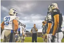  ?? STAFF PHOTO BY ROBIN RUDD ?? Captains for Trion, left, and host Gordon Lee watch as the referee makes the pregame coin toss before their rivalry football matchup this past Sept. 20 in Chickamaug­a, Ga.