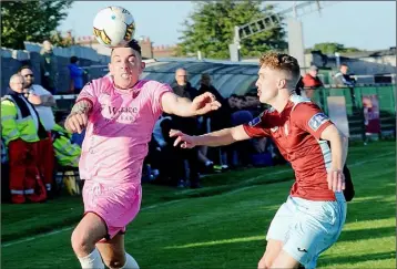  ??  ?? Full-back Ricky Fox trying hard to unhinge the Cobh Ramblers defence.