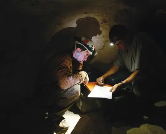  ?? (Baz Ratner/Reuters) ?? RESEARCHER­S INSIDE an archaeolog­ical site near Beit Guvrin, 2011. The protagonis­t-girl goes on an adventurou­s dig in the area.