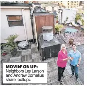  ??  ?? MOVIN’ ON UP: Neighbors Lee Larson and Andrew Cornelius share rooftops.