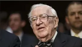  ?? Associated Press ?? Former Supreme Court Justice John Paul Stevens prepares to testify before the Senate Rules Committee on April 30, 2014, in Washington. Mr. Stevens died Tuesday at 99 after suffering a stroke.