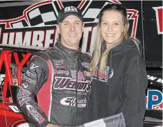  ?? ALEX & HELEN BRUCE PHOTO ?? Racer Mat Williamson celebrates a victory at Humberston­e Speedway with fiancée Natalie Flake. The Port Colborne track is scheduled to host 10 Modified races in 2022.