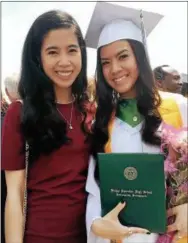  ?? SUBMITTED PHOTO ?? Bishop Shanahan High School graduate Rebecca Nguyen received an award for having perfect attendance in 13 years of school. She poses with her sister Bianca Nguyen.