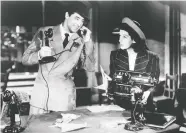  ?? COLUMBIA PICTURES ?? Cary Grant, left, and Rosalind Russell try to get the scoop in the 1940 movie His Girl Friday.