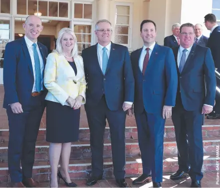  ??  ?? Prime Minister Scott Morrison is flanked by the Coast Cabinet connection (from left) Stuart Robert (Assistant Treasurer), Karen Andrews (Industry, Science and Technology), Steven Ciobo (Defence Industry) and Scott Buchholz (Assistant Roads and Transport).