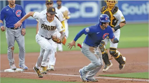  ?? SEAN M. HAFFEY/GETTY IMAGES ?? Padres starter Mike Clevinger chases down Rafael Ortega during a fielder’s choice in the first inning of the Cubs’ 5-4 loss Tuesday night.