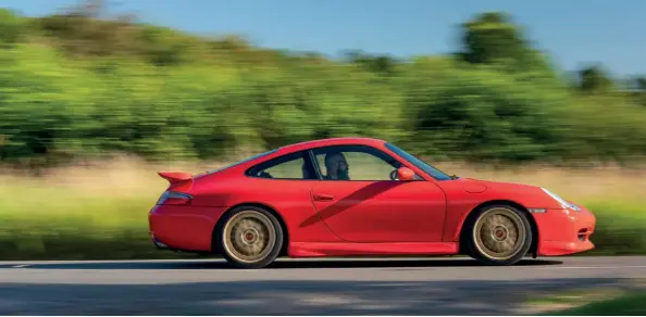  ??  ?? Above While its orange-lit dashboard instrument­ation feels dated, the 996 carries Porsche’s classic 911 silhouette with grace