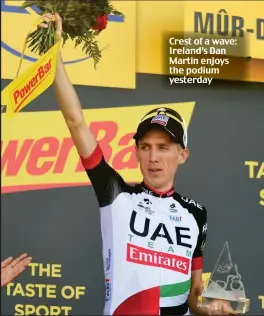  ??  ?? Crest of a wave: Ireland’s Dan Martin enjoys the podium yesterday