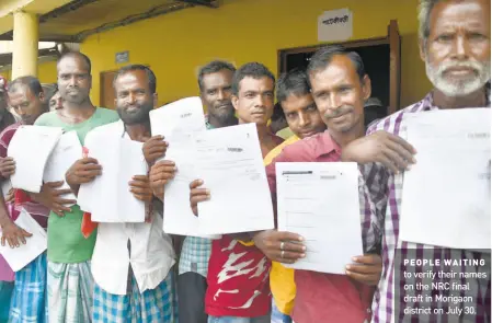  ?? RITU RAK KONWAR ?? PEOPLE WAITING to verify their names on the NRC final draft in Morigaon district on July 30.