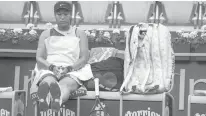  ?? JAMES HILL/THE NEW YORK TIMES ?? Naomi Osaka between sits during her match against Amanda Anisimova at the French Open on Monday in Paris. Anisimova won, 7-5, 6-4, in the first round.