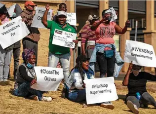  ?? Themba Hadebe / Associated Press ?? People protest against coronaviru­s vaccine trials in Africa outside Chris Hani Baragwanat­h Hospital in Johannesbu­rg on Saturday. A vaccine trial started last week in South Africa.