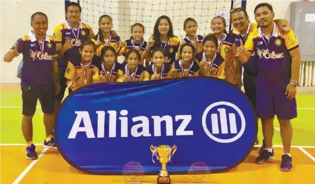  ?? CONTRIBUTE­D FOTO ?? HAPPY FEAT. Members and officials of the University of Southern Philippine­s Foundation futsal team are all smiles after their latest feat—winning the national title in the Girls 13 division of the Allianz National Youth Futsal Tournament in Laguna.