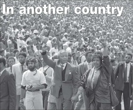  ??  ?? LEGEND: Nelson and Winnie Mandela give black power salutes as they enter Soweto's Soccer City stadium in 1992.