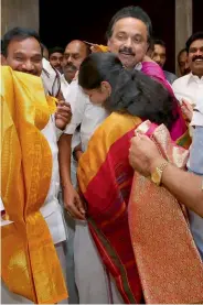  ?? — PTI ?? DMK working president M. K. Stalin greets his sister and Rajya Sabha MP Kanimozhi upon her arrival at the Chennai airport on Saturday after her acquittal in the 2G case.