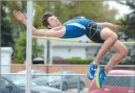  ?? NEWS PHOTO SEAN ROONEY ?? Lewis Benoy competes in high jump during the Medicine Hat city high school track meet Tuesday at Rotary Track. The Crescent Heights athlete set a new record, clearing 1.90 metres.