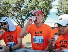  ?? LAINE MOGER/FAIRFAX NZ ?? From left, team mates Martin Kent, Paul Cornish and Dennis Waru reward themselves with an icecream.