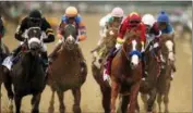  ?? AP PHOTO/ANDRES KUDACKI ?? Justify (1), with jockey Mike Smith up, leads the pack as it approaches the first turn during the 150th running of the Belmont Stakes horse race, Saturday, June 9, 2018, in Elmont, N.Y.