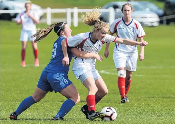  ?? PHOTO: LINDA ROBERTSON ?? You’re not having that . . . Southern United’s Chelsea Whittaker attempts to take the ball off Auckland’s Paige Satchell during the national women’s league match at Tahuna Park yesterday.