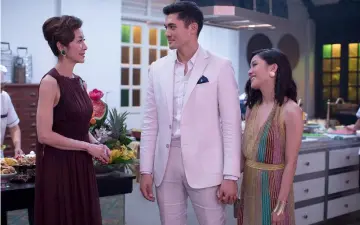  ?? — Photo courtesy of Warner Bros. Pictures ?? (From left) Tan Sri Michelle Yeoh, Henry Golding and Constance Wu star in “Crazy Rich Asians.”