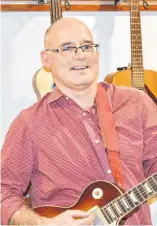  ?? ELIZABETH PATTERSON • CAPE BRETON POST ?? Dr. Tom Hewlett is a Sydney-based nephrologi­st who also enjoys playing the guitar in his spare time.