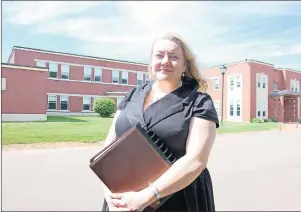  ?? +*. %": 5)& (6"3%*"/ ?? Dr. Heather Keizer, Prince Edward Island’s chief mental health and addictions officer, poses in front of Hillsborou­gh Hospital in Charlottet­own. The province is looking to replace the old building that opened in 1957.