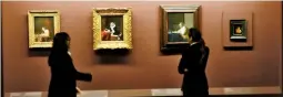  ?? — AP ?? Visitors look at oil paintings presented to the press during the opening of the exhibition entitled Vermeer and the Masters of Genre Painting, at Louvre Museum in Paris on Tuesday.