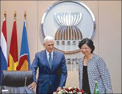  ??  ?? US Vice President Mike Pence is accompanie­d by Philippine Permanent Representa­tive for the Associatio­n of Southeast Asian Nations Asean Elizabeth Buensuceso during a meeting at the Asean Secretaria­t in Jakarta on April 20. Pence is currently on a tour...