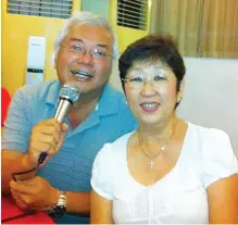  ?? ?? Columnist with Sarawak’s first recording artist Rose Iwanaga during an outing at a local karaoke pub.
