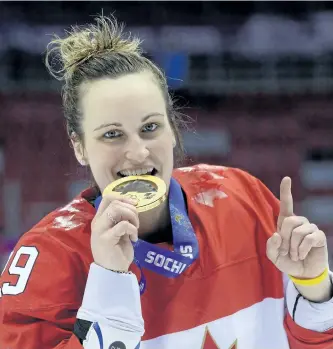  ?? JONATHAN NACKSTRAND/GETTY IMAGES ?? Canada’s Marie-Philip Poulin celebrates with her gold medal during the 2014 Sochi Winter Olympics women’s hockey victory ceremony, at the Bolshoi Ice Dome on Feb. 20, 2014.