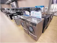  ?? RICK BOWMER/ASSOCIATED PRESS ?? Kenmore front-load washers and dryers are displayed at a Sears store in West Jordan, Utah. Sears started in the 1880s as a mail-order catalog business.