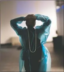  ??  ?? Traveling nurse Patricia Carrete of El Paso, Texas, walks down the hall during a night shift at the field hospital.