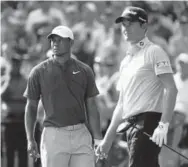  ?? Jamie Squire, Getty Images ?? Tiger Woods, left, and Webb Simpson check out the action Saturday during the third round of the PGA Championsh­ip.