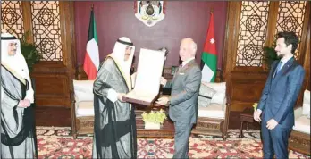  ?? ?? King Abdullah II presents Kuwait’s HH the Amir with Jordan’s highest distinctio­n.